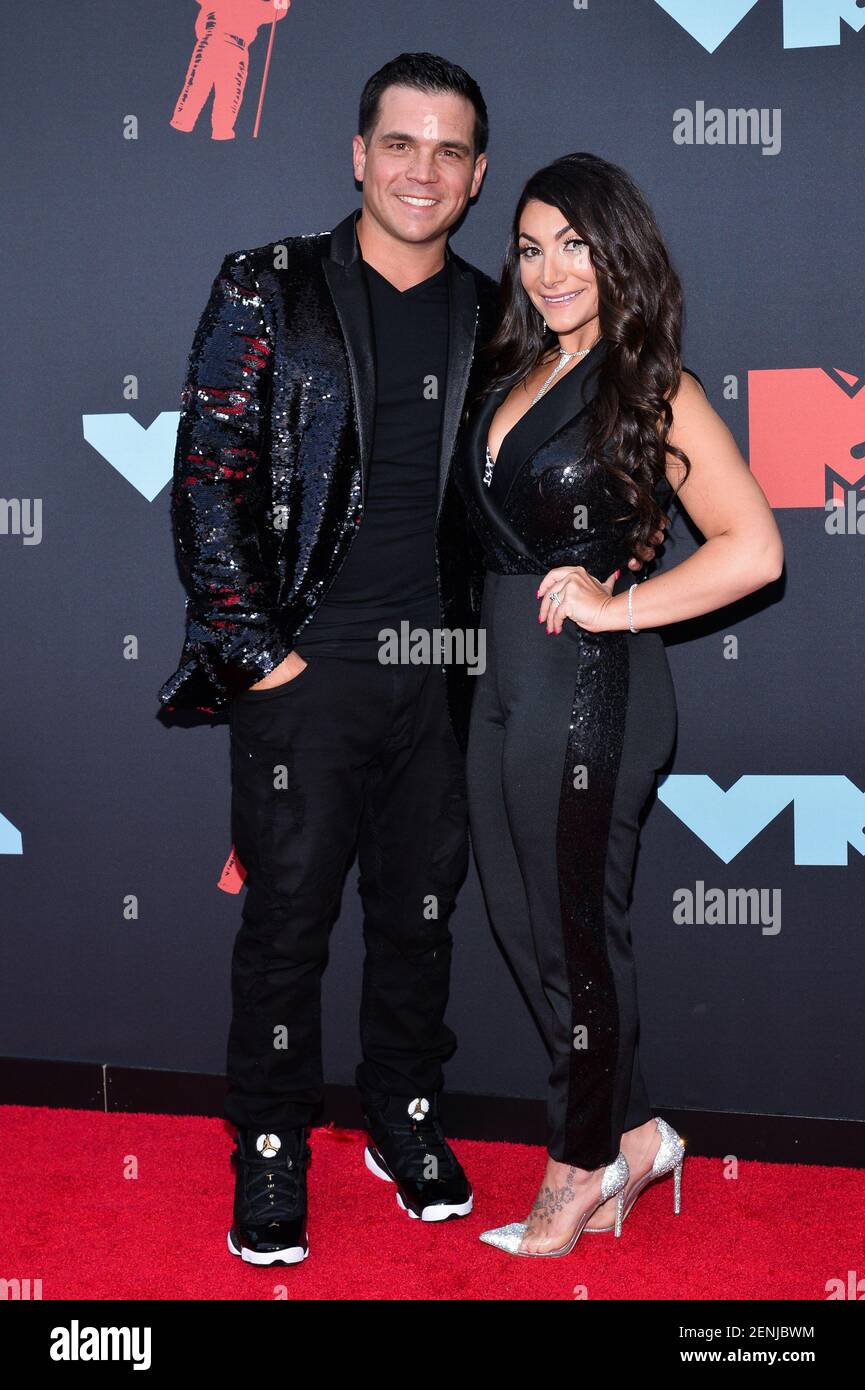 Christopher Buckner and Deena Cortese arriving on the red carpet at the