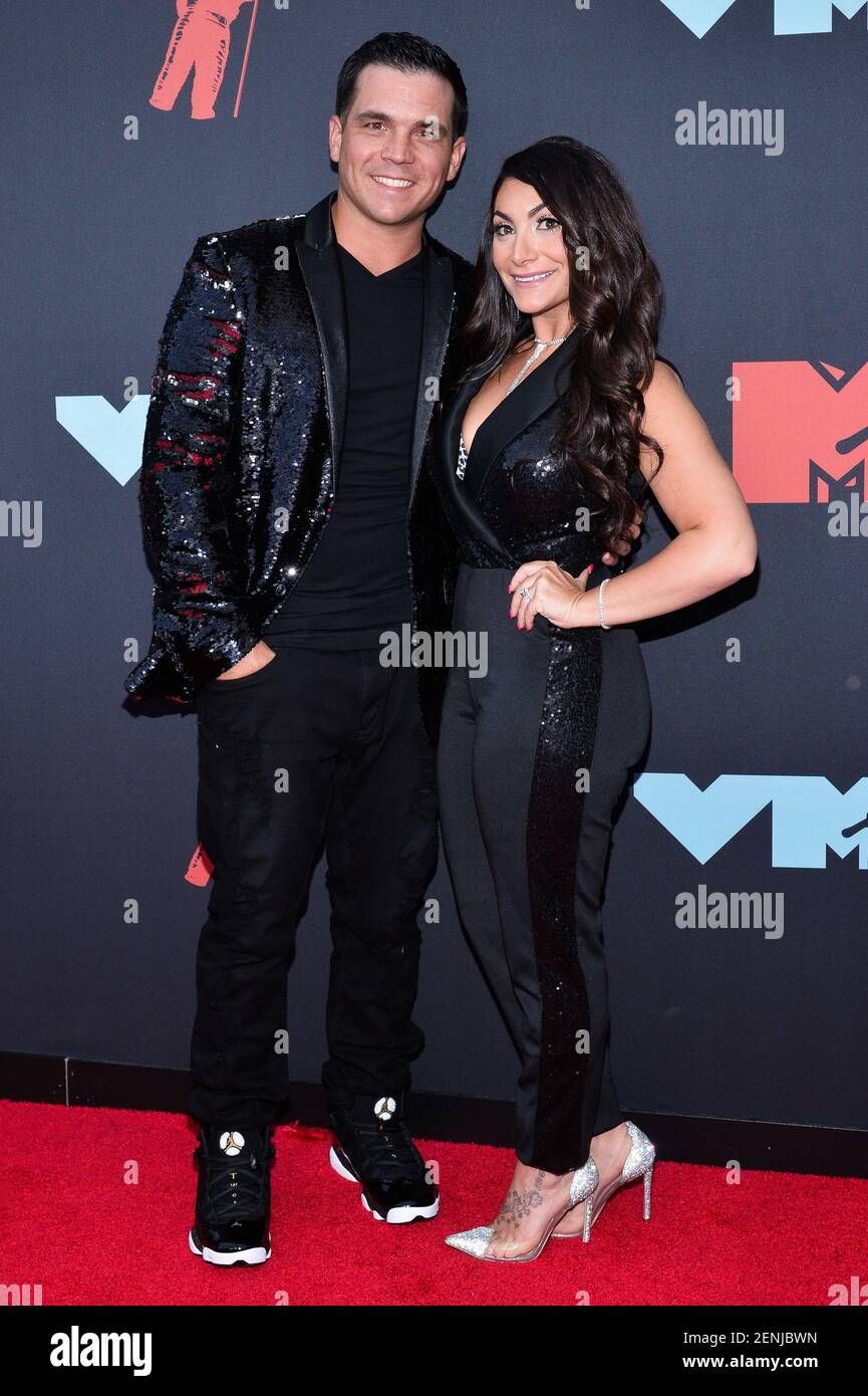 Christopher Buckner and Deena Cortese arriving on the red carpet at the