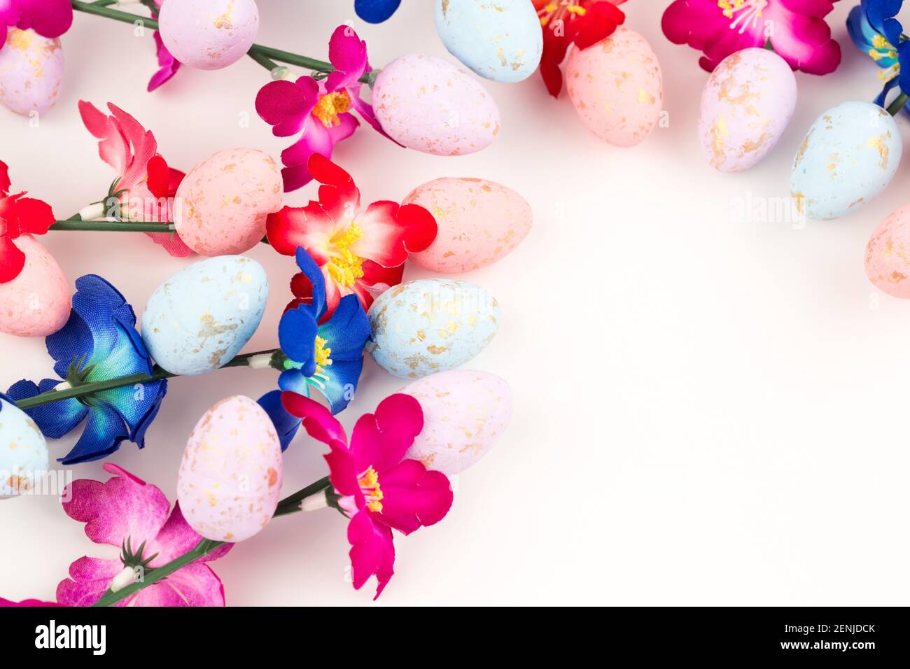 Easter colorful eggs and flowers on white background Stock Photo - Alamy