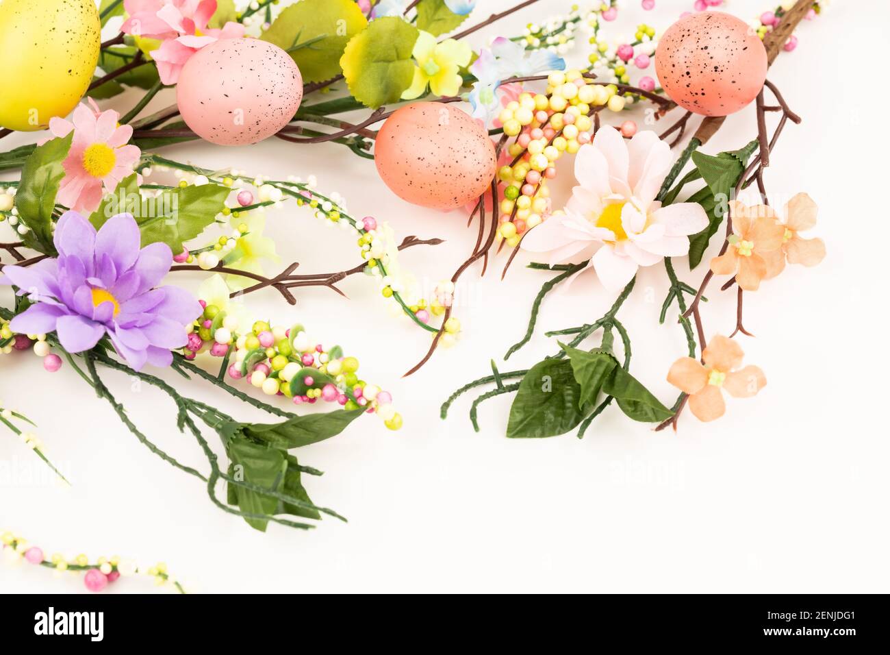 Easter colorful eggs and flowers on white background Stock Photo - Alamy