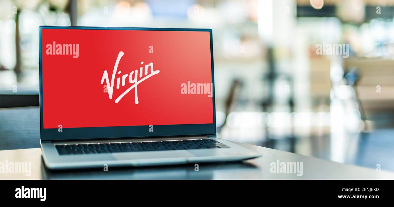 POZNAN, POL - JAN 6, 2021: Laptop computer displaying logo of Virgin Group, a British multinational venture capital conglomerate Stock Photo