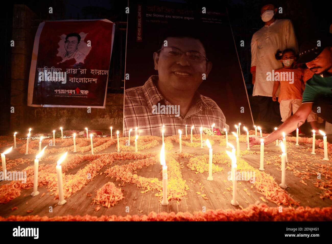 Dhaka, Bangladesh - February 26, 2021: People gather in Dhaka to lighting a candle remembering the murder of the Bangladeshi American blogger, writer Stock Photo