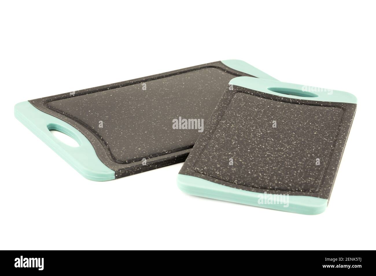 Two black plastic cutting boards isolated on white background. Stock Photo