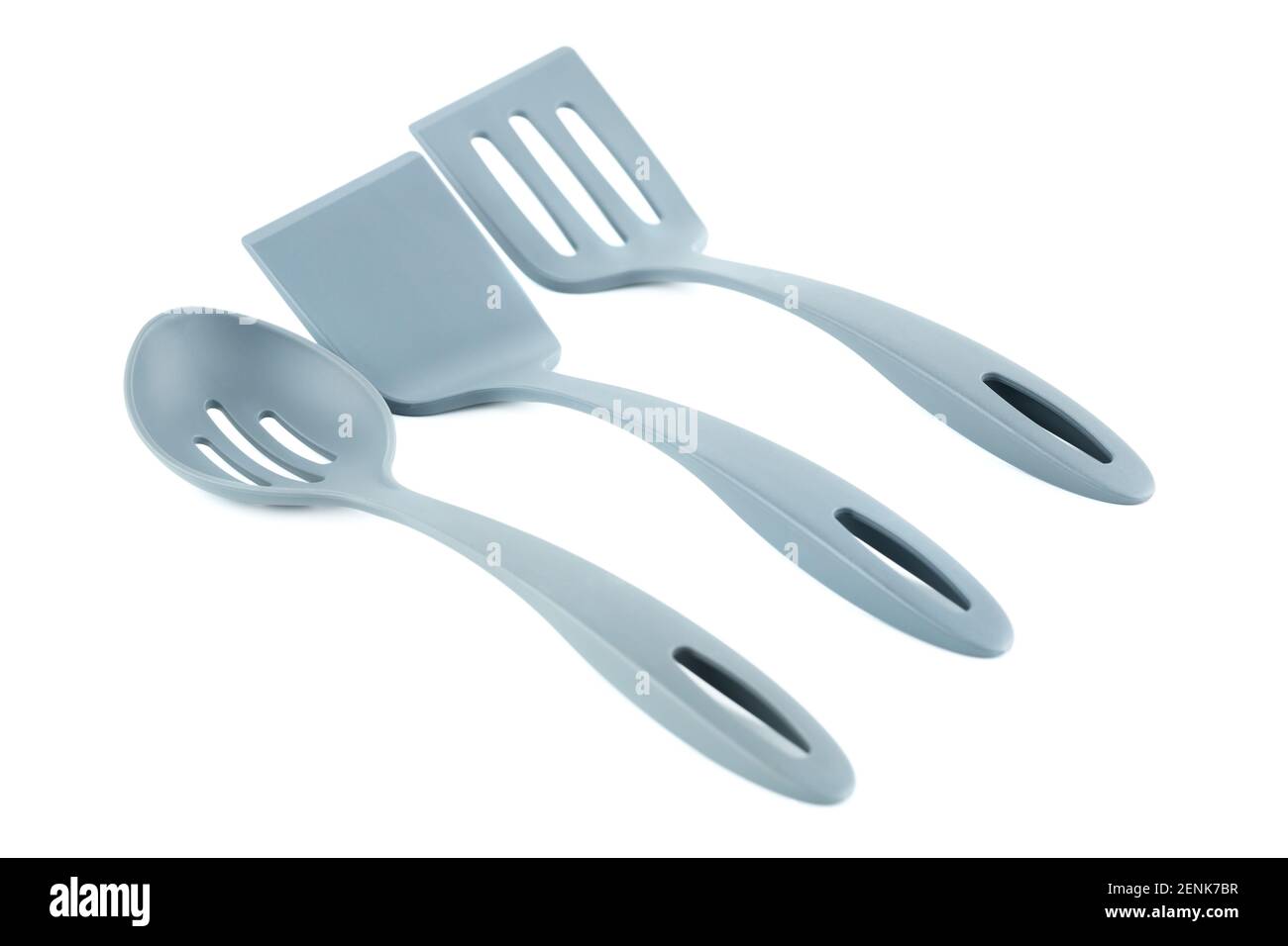Set of gray plastic kitchen utensils isolated on white background. Stock Photo