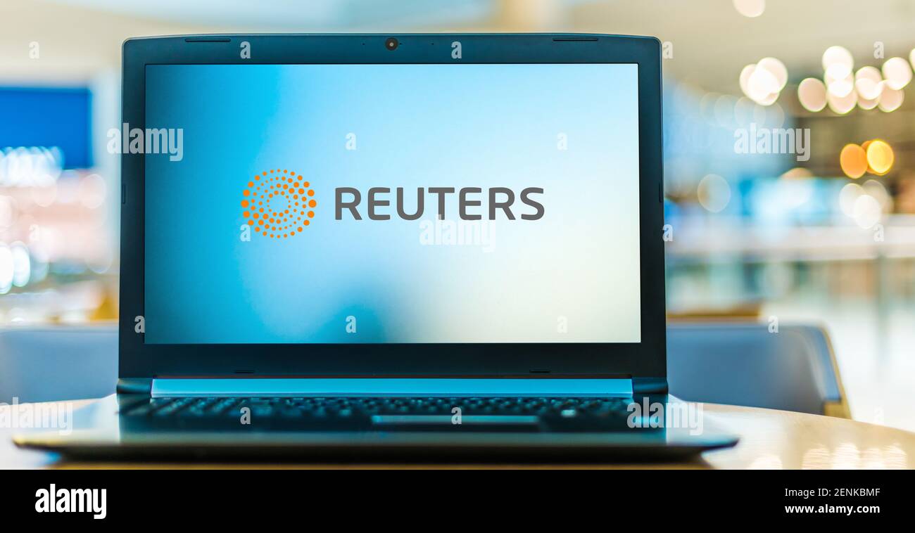 POZNAN, POL - JAN 6, 2021: Laptop computer displaying logo of Reuters, an international news organization owned by Thomson Reuters Stock Photo