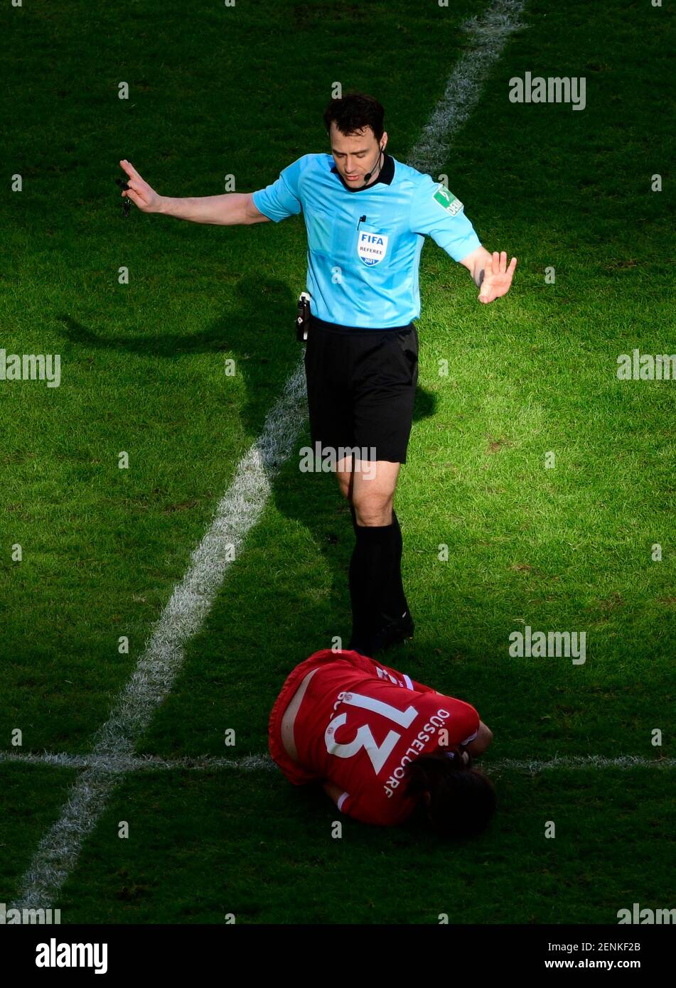 Merkur Spielarena Duesseldorf Germany  21.2.2021, Football:  2nd Bundesliga Season 2020/21, matchday 22, Fortuna Duesseldorf (F95, red) vs Hannover 96 (H96, green)  - Referee Felix Zwayer takes care of Adam Bodzek (F95)         DFL REGULATIONS PROHIBIT ANY USE OF PHOTOGRAPHS AS IMAGE SEQUENCES AND OR QUASI VIDEO Stock Photo