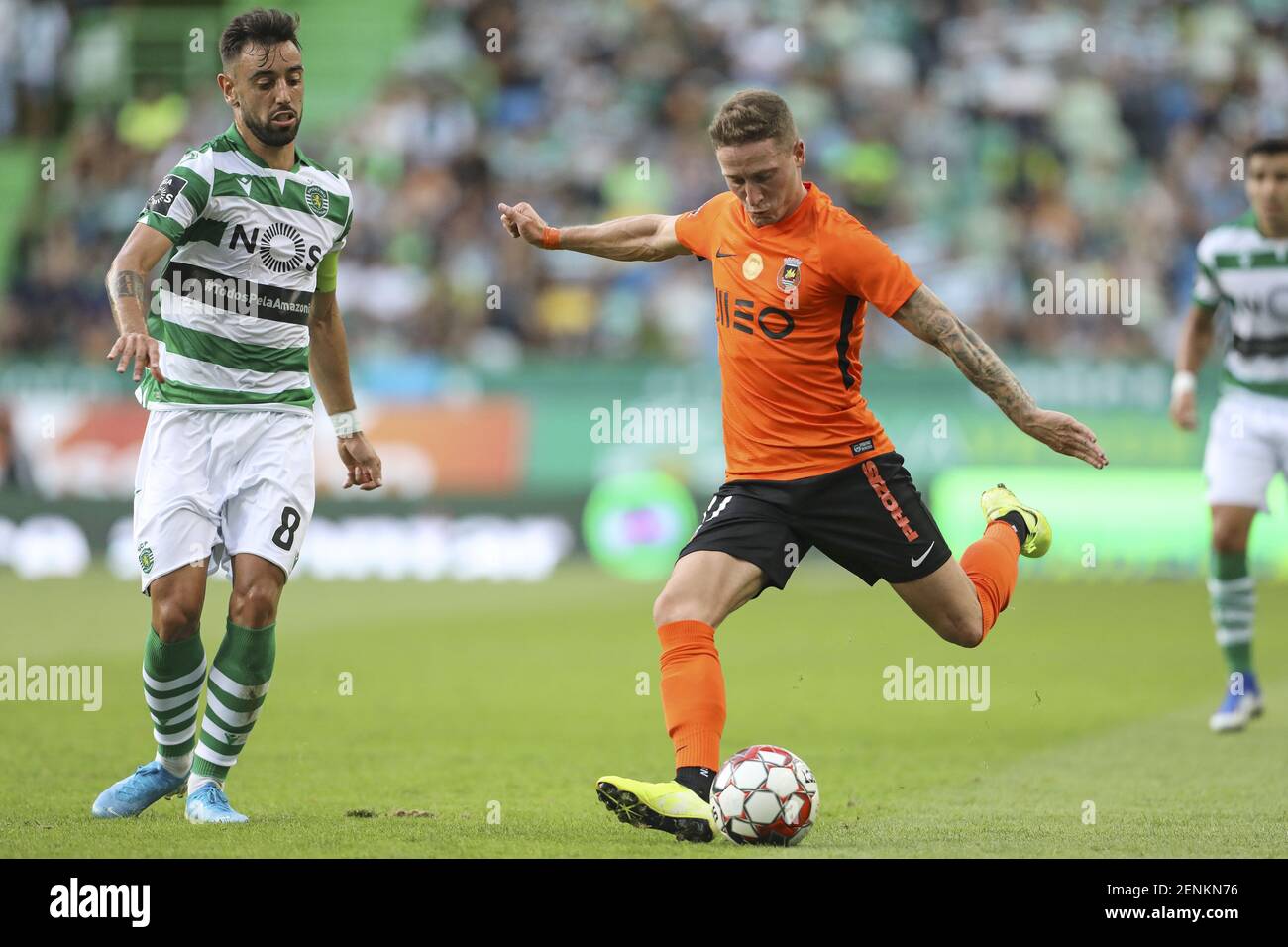 Bruno Fernandes of Sporting CP (L) vies for the ball with Nuno Santos of Rio  Ave FC (R) during the League NOS 2019/20 football match between Sporting CP  vs Rio Ave FC. (