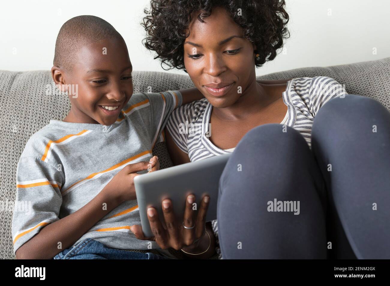 Mother and son using digital tablet Stock Photo