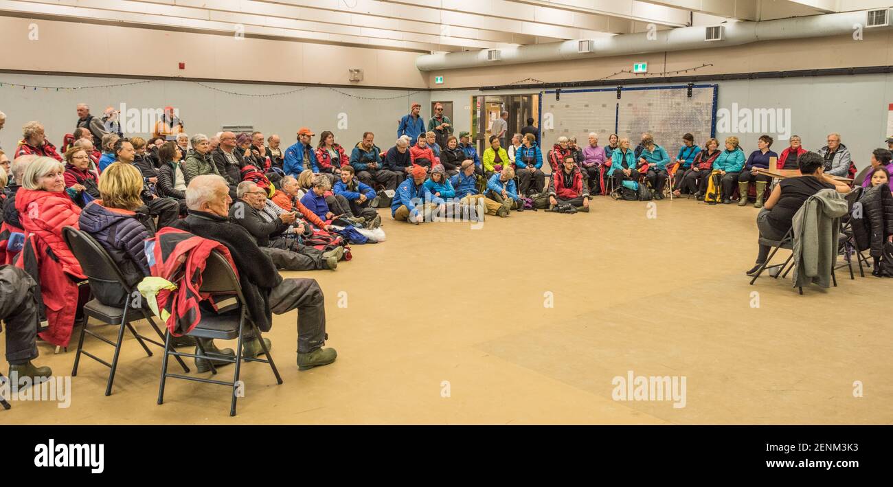 Tourist in community centre for folkloric performance, Pangnirtung, Baffin Island, Nunavut, Canada Stock Photo