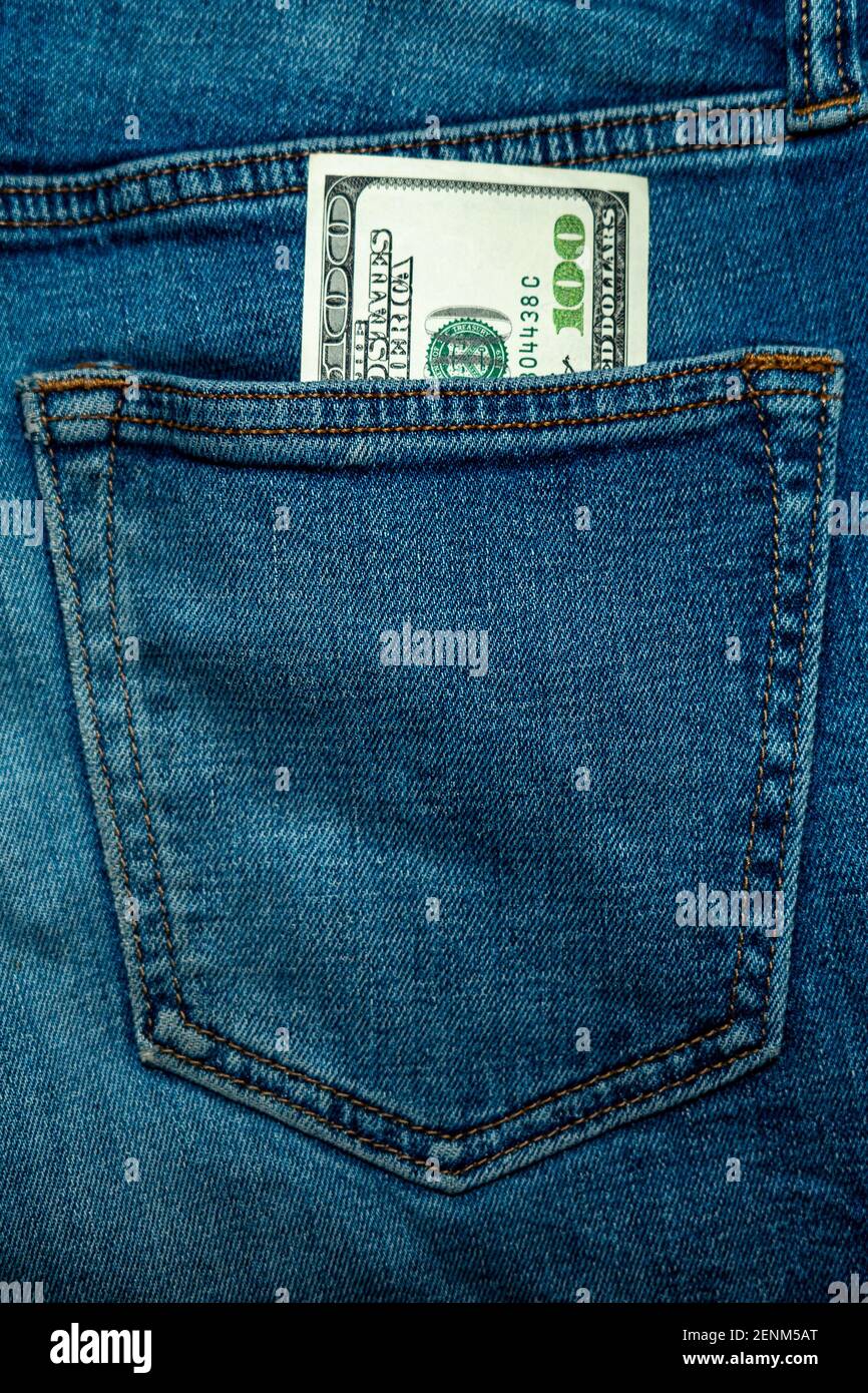 One hundred dollars in jeans pocket, vertical photo Stock Photo Alamy