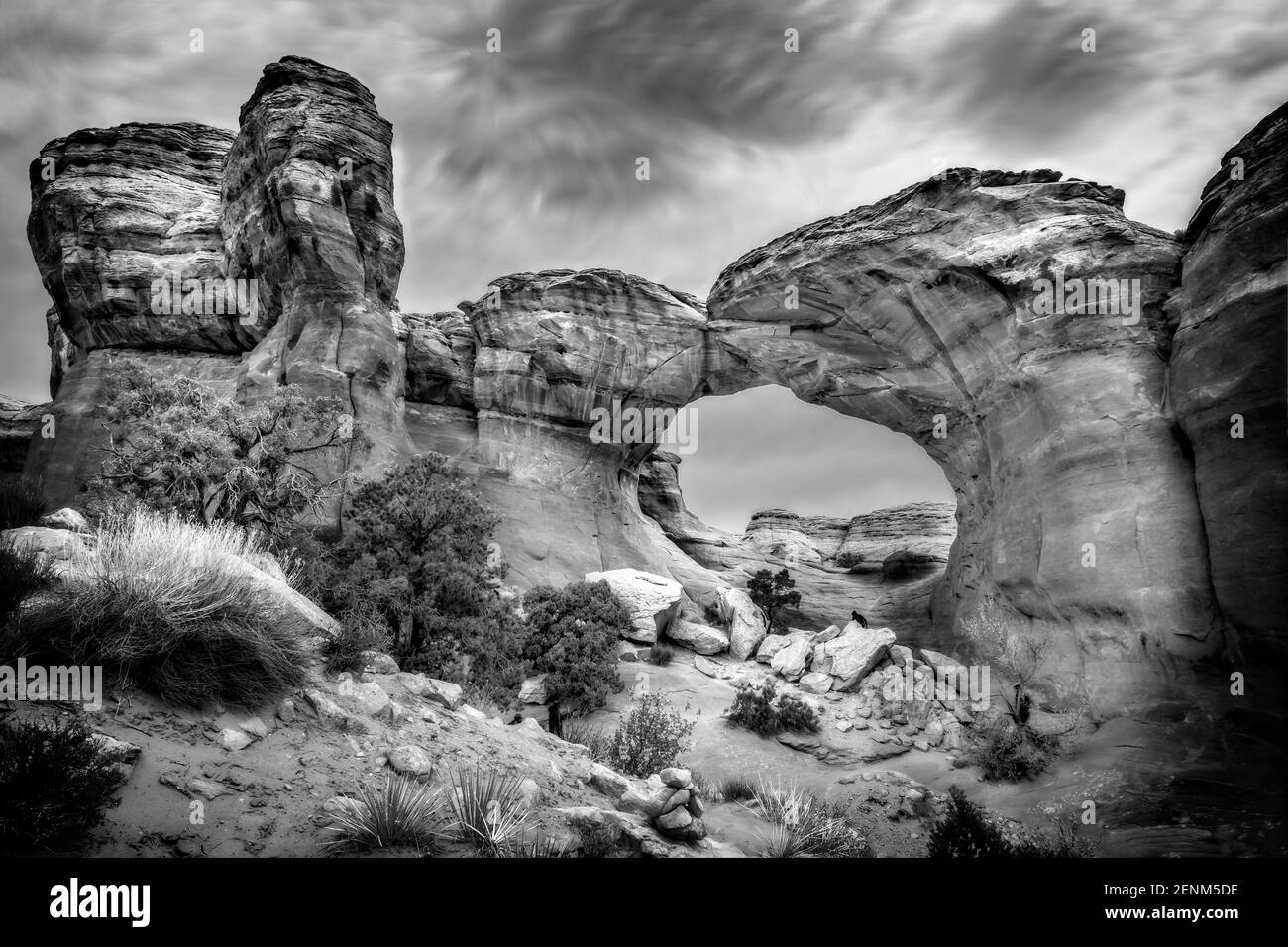 The famous Broken Arch in the Arches National Park, Utah and dramatic dark clouds Stock Photo