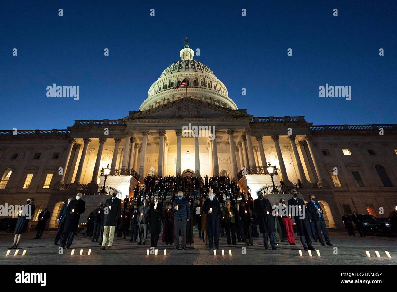 Members of Congress led by Senate Majority Leader Chuck Schumer and Minority Leader Mitch McConnell hold a candlelight vigil and moment of silence for the over 500,000 Americans who have died from COVID-19 outside the U.S. Capitol February 23, 2021 in Washington, D.C. Stock Photo