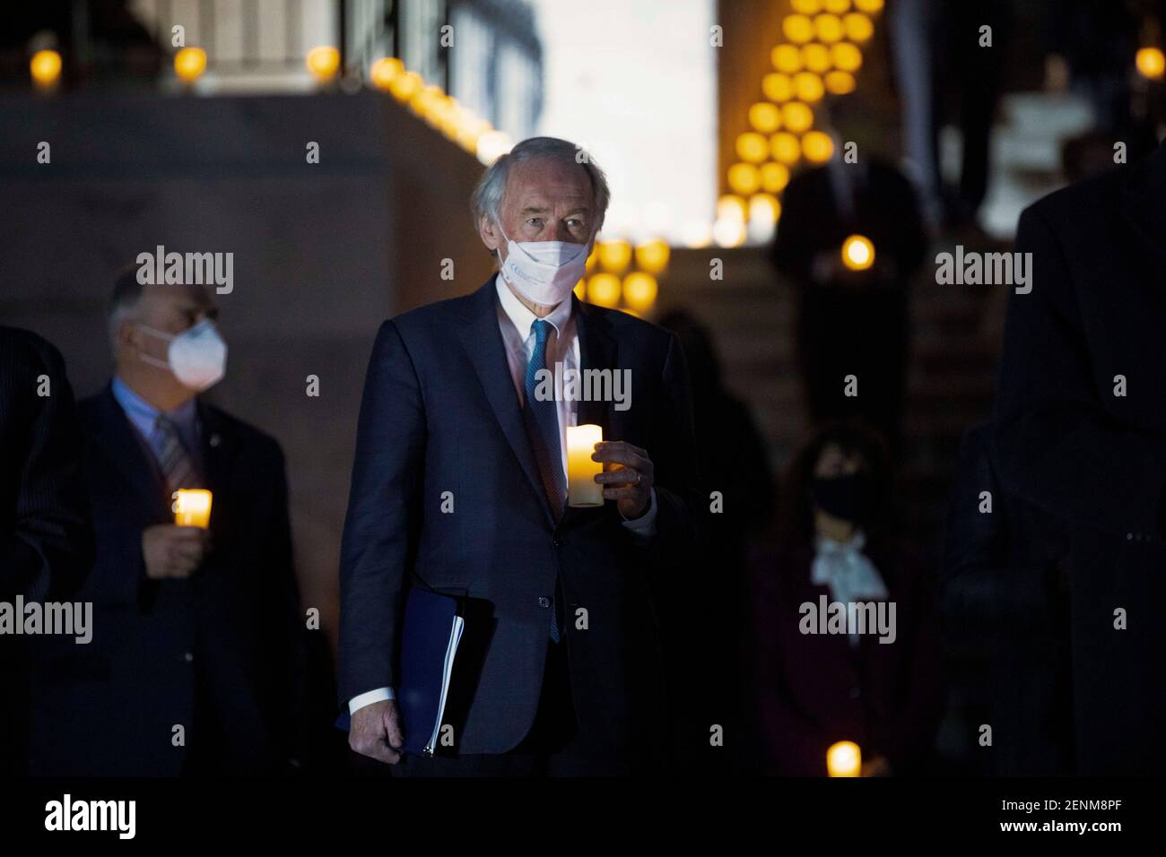 Senator Ed Markey, center, joins members of Congress during a candlelight vigil and moment of silence for the over 500,000 Americans who have died from COVID-19 outside the U.S. Capitol February 23, 2021 in Washington, D.C. Stock Photo