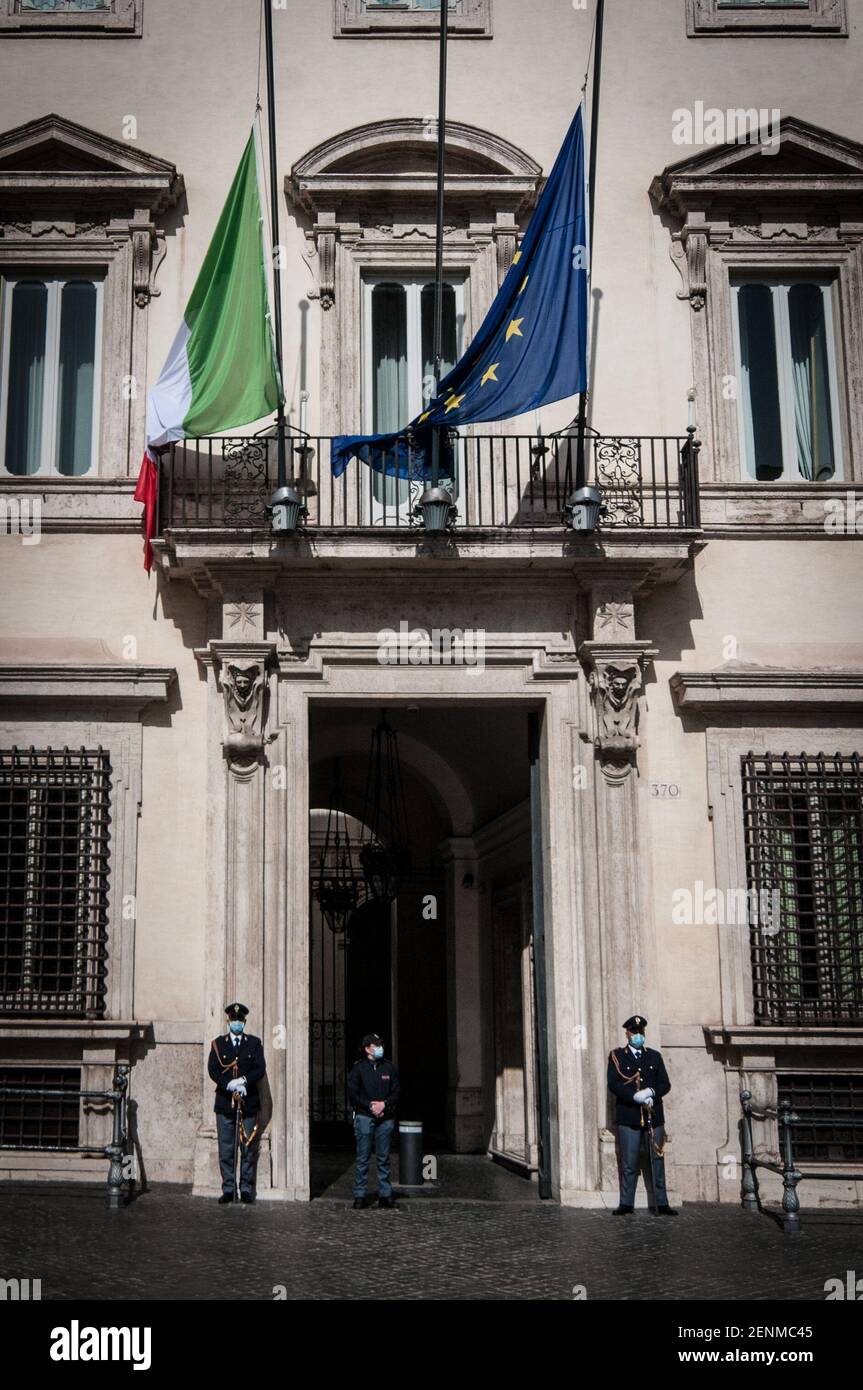 Rome, Italy. 25th Feb, 2021. (2/25/2021) National Mourning the flag of Italy and the flag of the European Union are exposed at half-mast on Palazzo Chigi, seat of the Italian Government, on the occasion of the State funeral for the Italian Ambassador in the Democratic Republic of Congo, Luca Attanasio, and the Carabiniere Vittorio Iacovacci, victims of a cowardly terrorist attack on February 22 in Congo. (Photo by Andrea Ronchini/Pacific Press/Sipa USA) Credit: Sipa USA/Alamy Live News Stock Photo