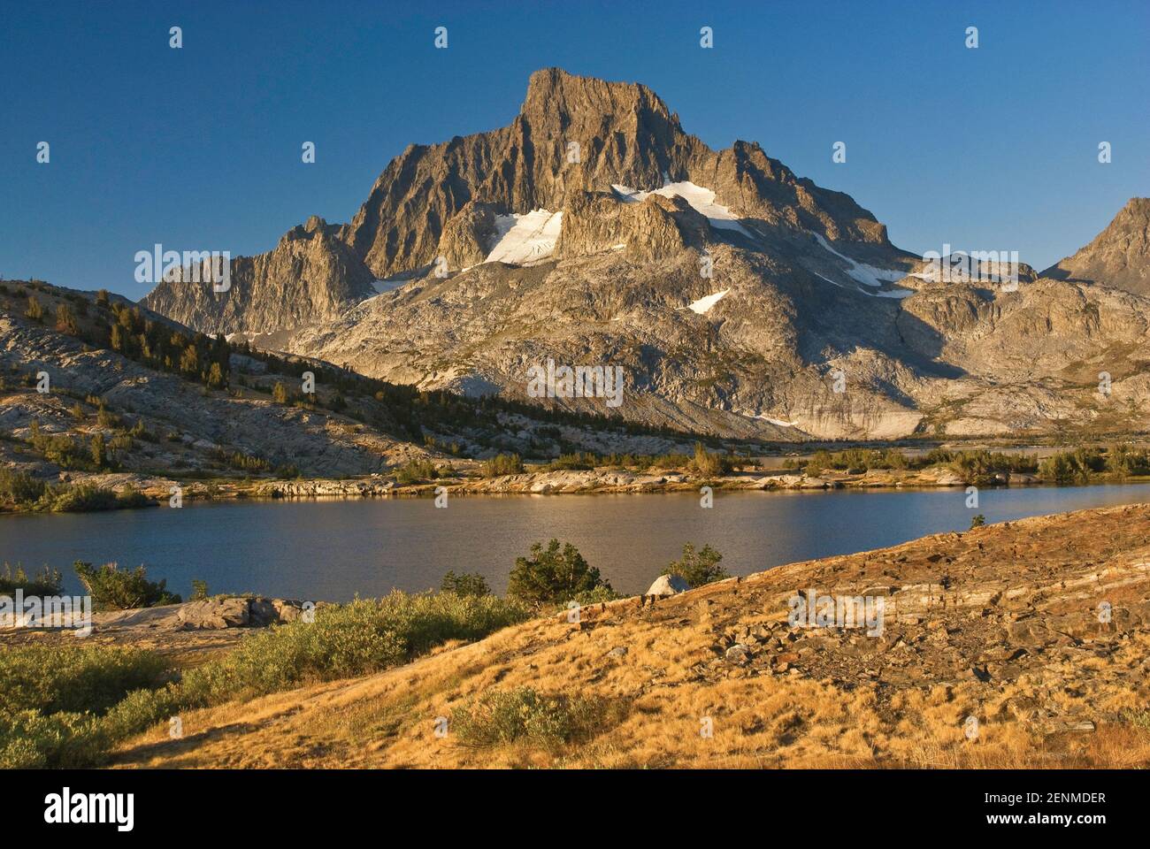 Banner Peak from John Muir Trail over Thousand Island Lake at sunrise, Sierra Nevada, Ansel Adams Wilderness, California, USA Stock Photo