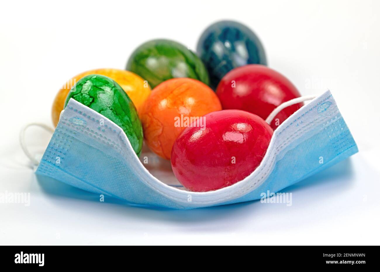 Colorful Easter eggs on a medical face mask Stock Photo