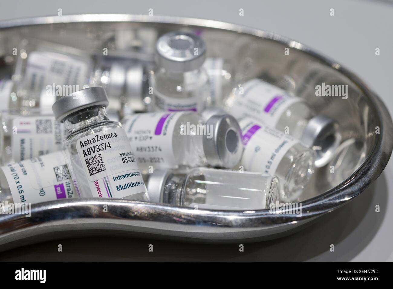 GERMANY, Hamburg, corona pandemic, largest vaccination center in Germany, for daily max 7000 people, preparation of vaccine for vaccination with syringe, empty glass vials of british swedish company AstraZeneca against corona virus Covid-19 Stock Photo