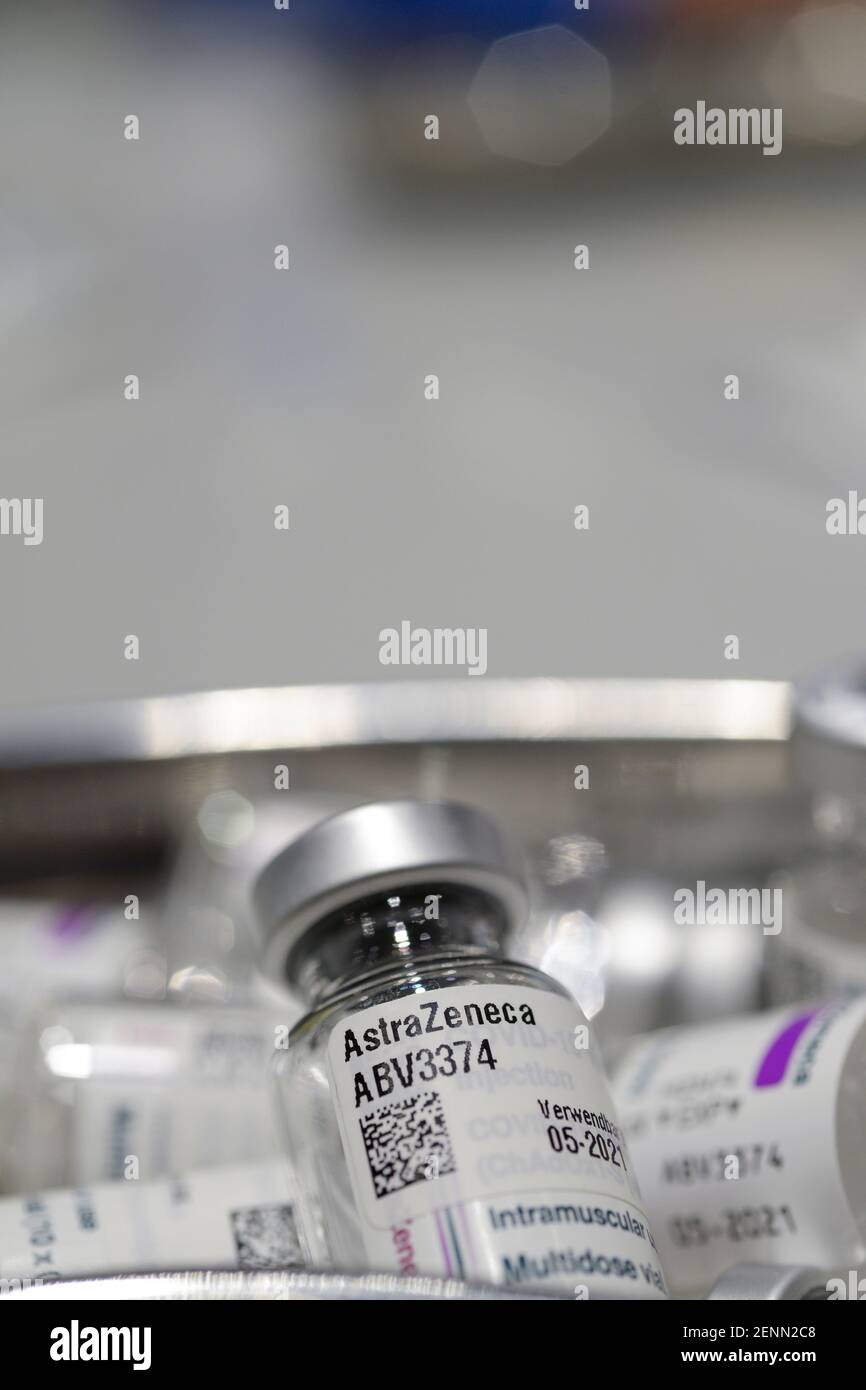 GERMANY, Hamburg, corona pandemic, largest vaccination center in Germany, for daily max 7000 people, preparation of vaccine for vaccination with syringe, empty glass vials of british swedish company AstraZeneca against corona virus Covid-19 Stock Photo