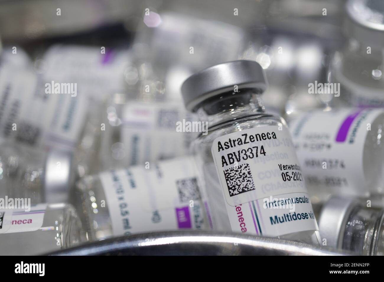 GERMANY, Hamburg, corona pandemic, largest vaccination center in Germany, for daily max 7000 people, preparation of vaccine for vaccination with syringe, empty glass vials of british swedish company AstraZeneca against corona virus Covid-19 Stock Photo
