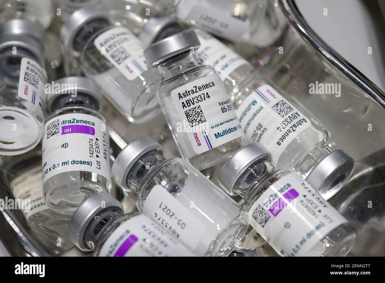 GERMANY, Hamburg, corona pandemic, largest vaccination center in Germany, for daily max 7000 people, preparation of vaccine for vaccination with syringe, empty glass vials of british swedish company AstraZeneca against corona virus Covid-19 Stock Photo