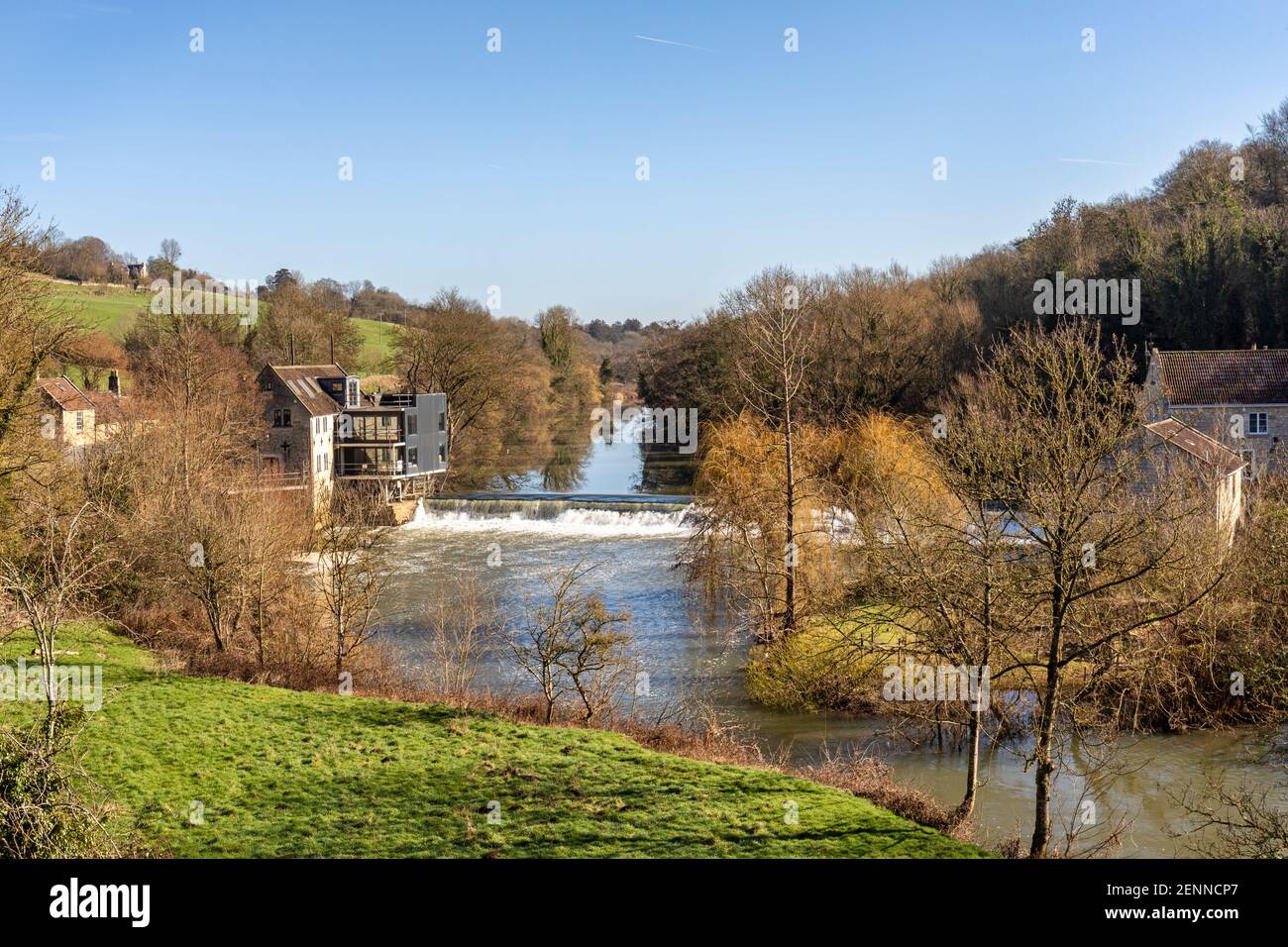 Avoncliff weir and old mill which is being renovated on a bright sunny