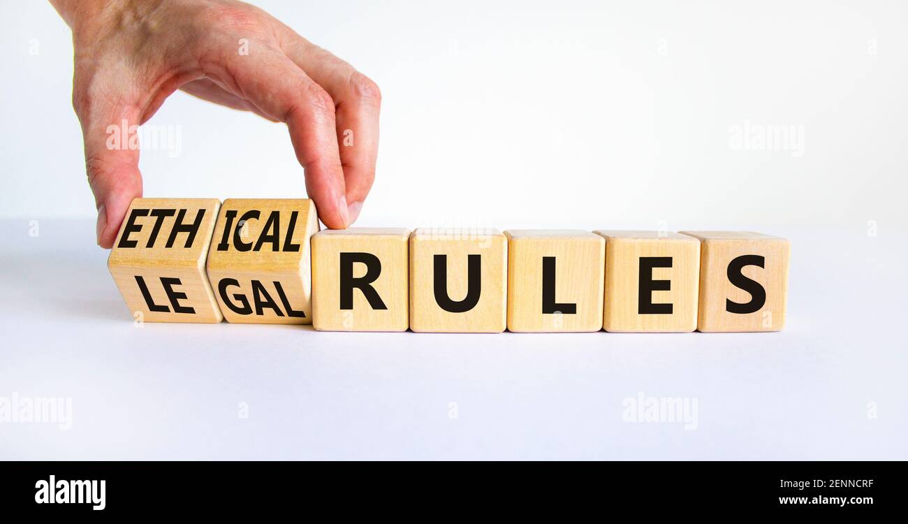 Legal Rules Image Ethical or legal rules symbol. Businessman turns wooden cubes and ...