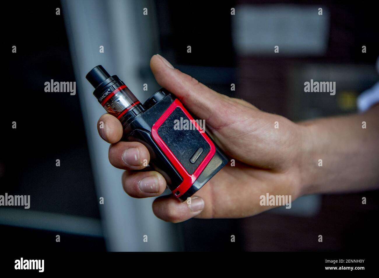 A person uses a handheld battery-powered vaporizer to smoke an e-cigarette  in Haarlem, The Netherlands on September 8, 2019. A string of recent deaths  in the USA have been blamed on vaping. (