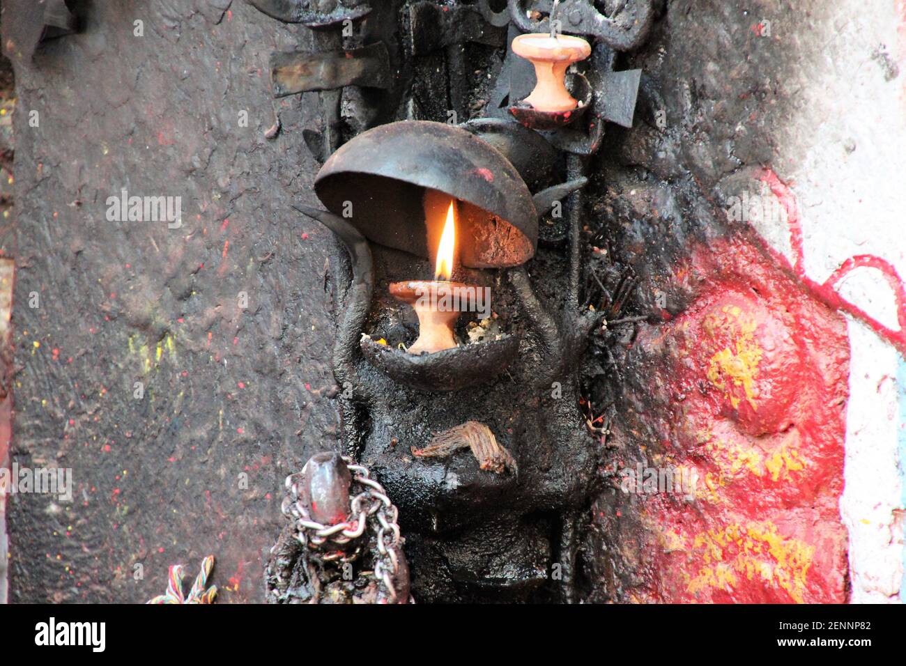 burning candle at a holy temple Stock Photo