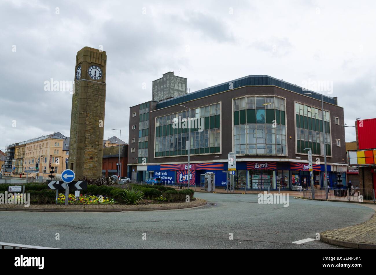 Rhyl, Denbighshire; UK: Feb 21, 2021: A general street scene showing  the B and M store on the High Street and the clock tower roundabout. Stock Photo