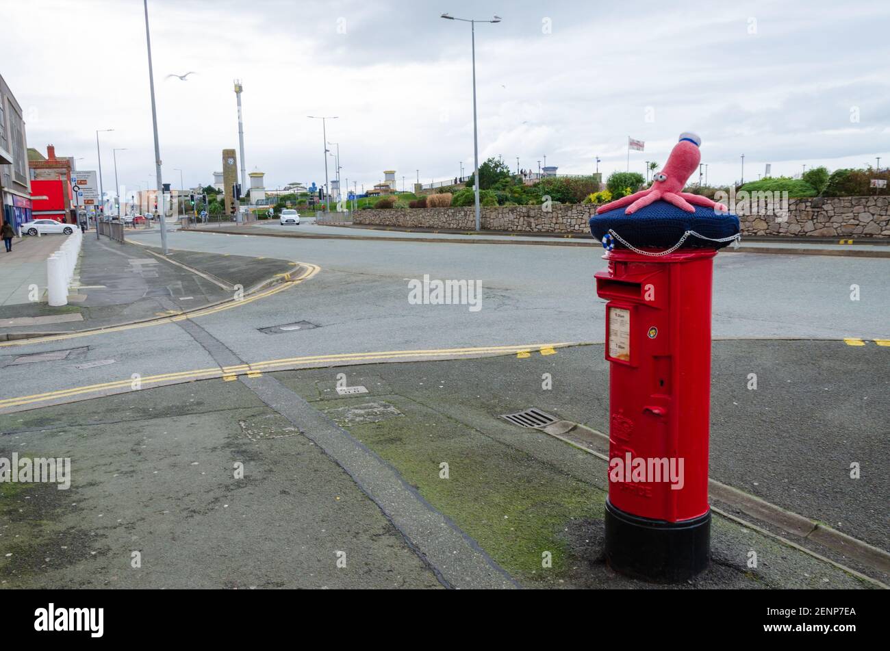 Rhyl, Denbighshire; UK: Feb 21, 2021: A post box is seen wearing a knitted decoration in the form of a pink octopus close to the Seaquarium of Rhyl Stock Photo