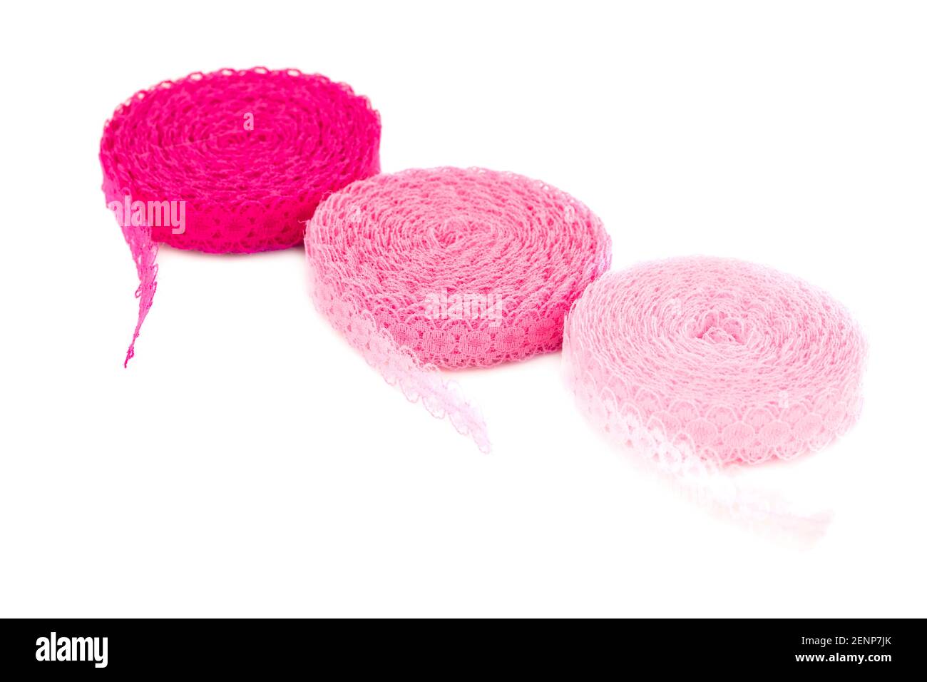 Three pink lace tapes isolated on white background. Stock Photo