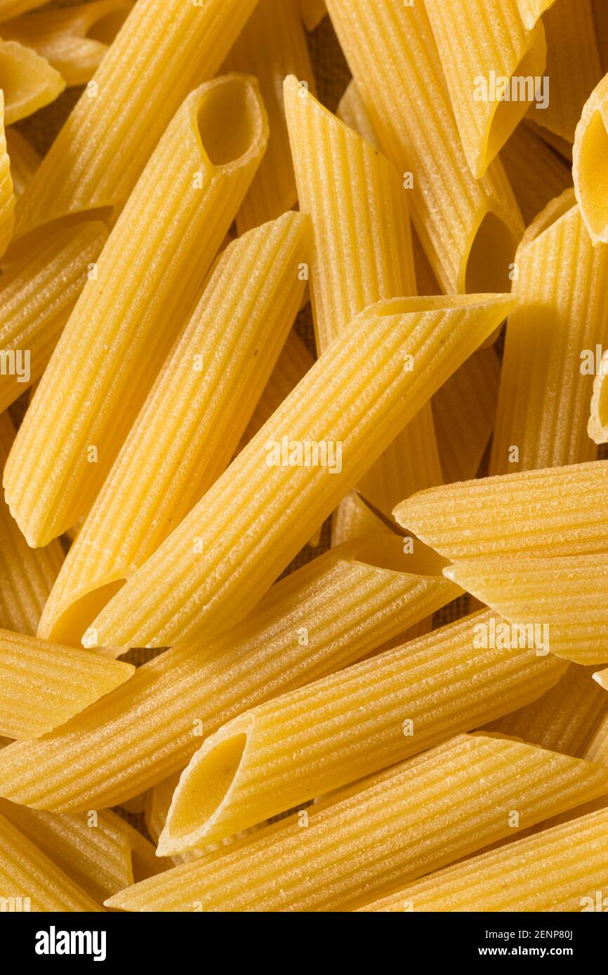 Raw Organic Dry Penne Pasta Ready to Cook Stock Photo Alamy