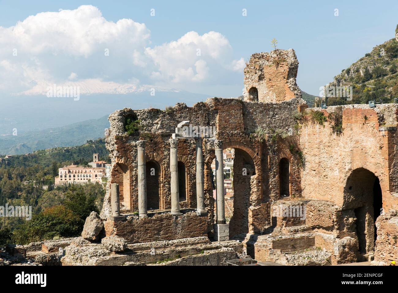 Italy,Sicily,Taormina, The Greek Theatre, with the city of Taormina and Mount Etna in the background. Stock Photo