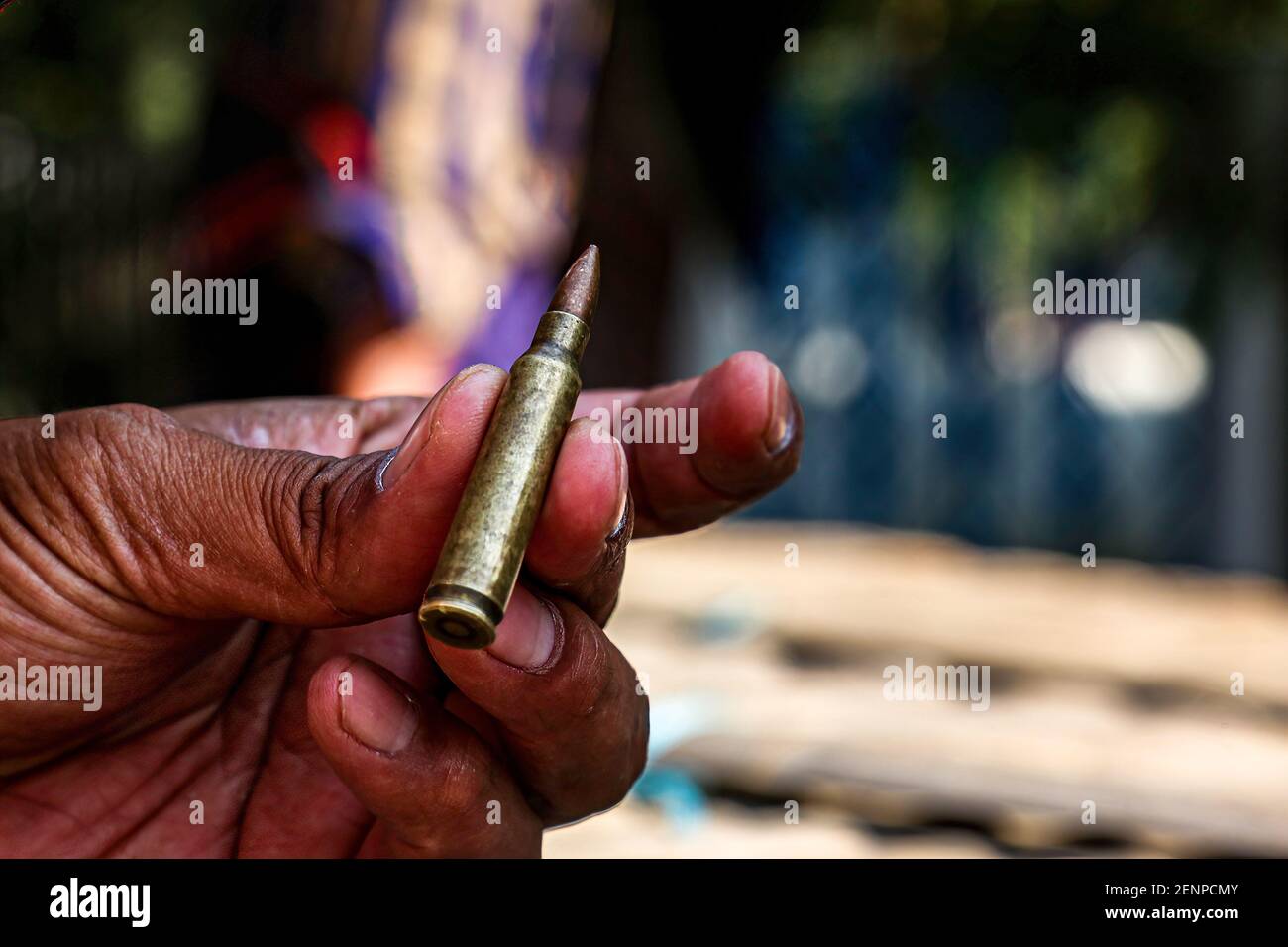 Mandalay, Myanmar. 26th Feb, 2021. A protester holds a bullet used by the police and military to harm peaceful protesters during an anti-coup demonstration.Myanmar Security Forces shot at anti-military coup protesters and those close to them with slingshots, rubber bullets and other materials thus injuring young children and many were arrested. Credit: SOPA Images Limited/Alamy Live News Stock Photo