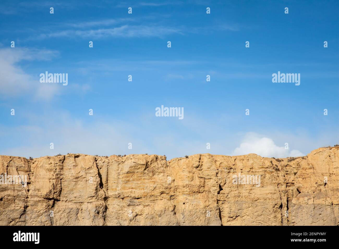 Steep sandstone wall and blue sky background in Spanien Andalusia Stock Photo