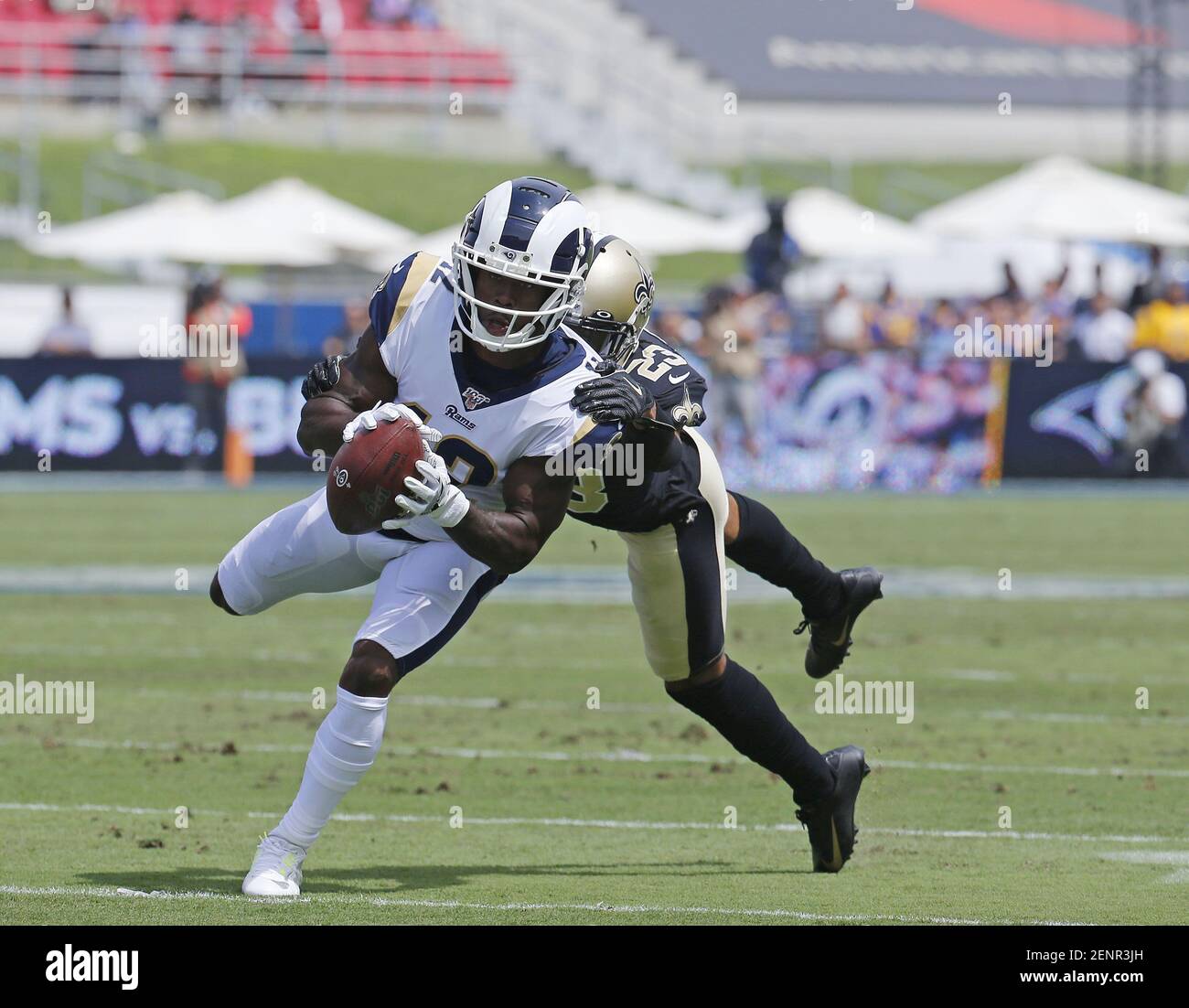 New Orleans Saints corner back Jabari Greer holds his children