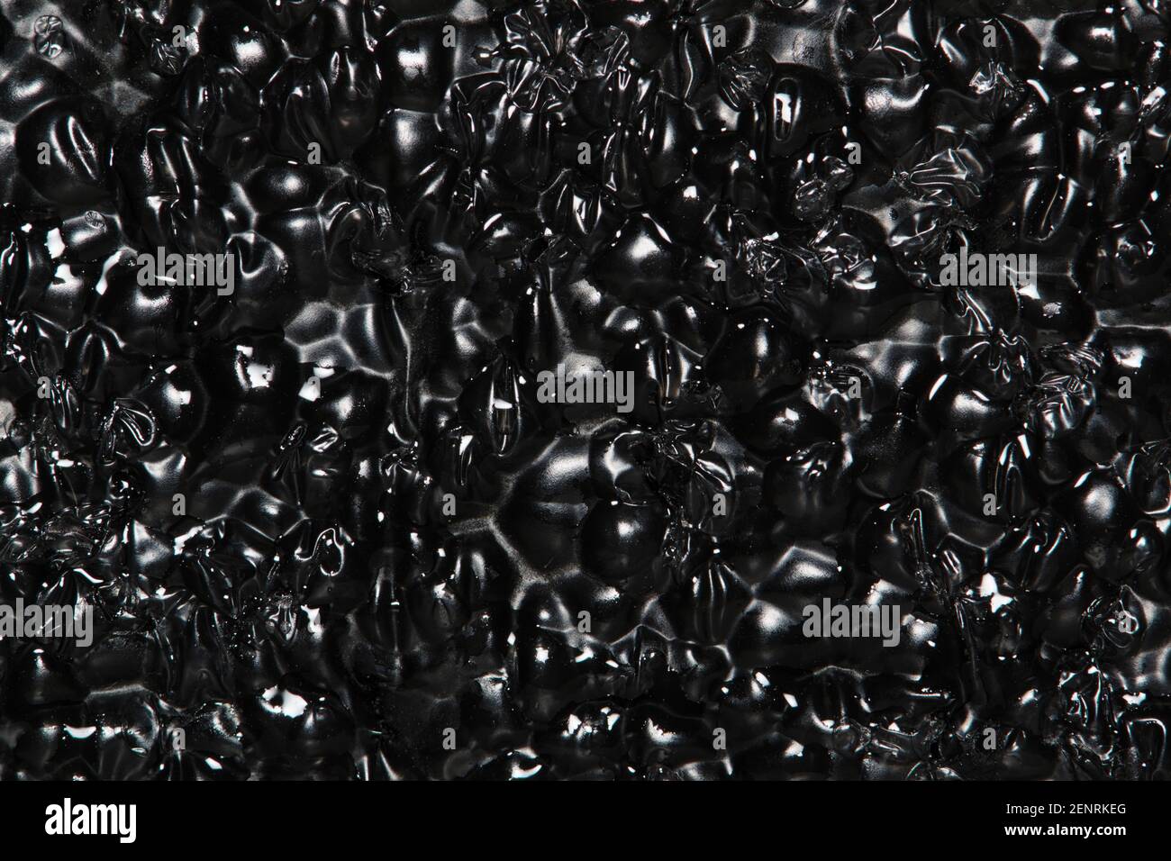 Black Expanded polyethylene foam sample background. EPE beads packing