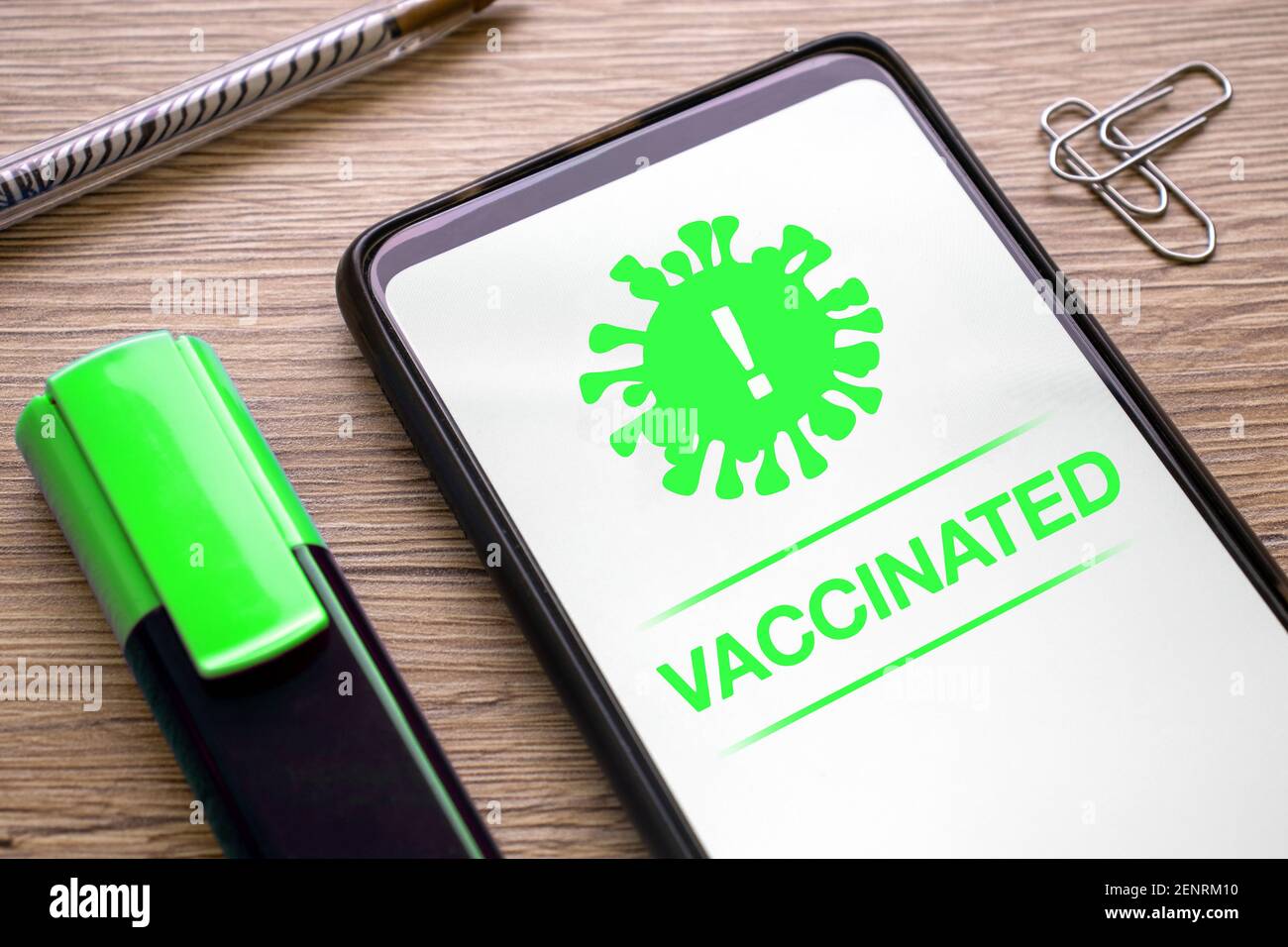 app for vaccinate with covid 19 virus with notification green vaccinated on the phone screen. smartphone application for vaccination certificate coron Stock Photo