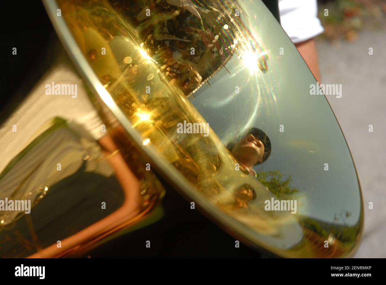 detail of tuba, wind instrument with reflection of man in alpine costum, Austria Stock Photo