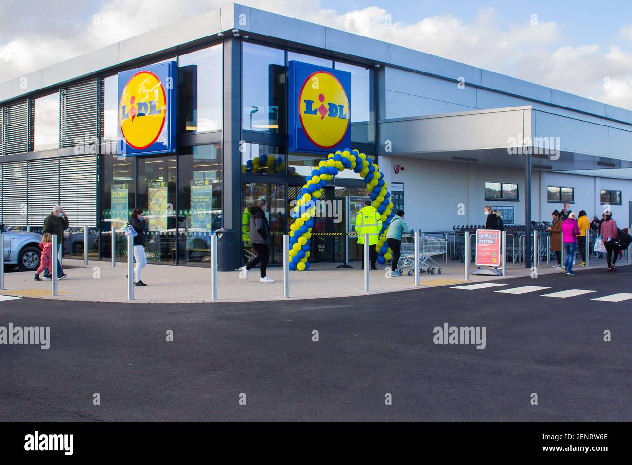 26 February 2021 Customers que outside of the brand new Lidl discount store in Castlebawn Retail Park in Newtownards, County Down on opening day Stock Photo