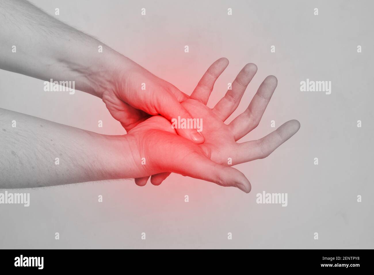 Person man massaging the palm of his hand for pain Stock Photo Alamy