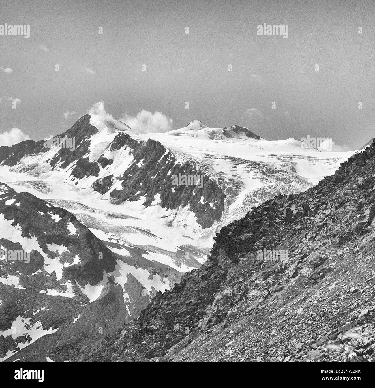 Austria, Tyrol. On the centre skyline is the Zuckerhutl at 3505m the highest mountain in the Stubai Alps with the Wilder Pfaff, the Wild Priest to the left, with the mass of the Sulzenau Ferner glacier in the centre as it was in 1968. Sadly lots of the glacier seen here has now gone due to global warming. Stock Photo