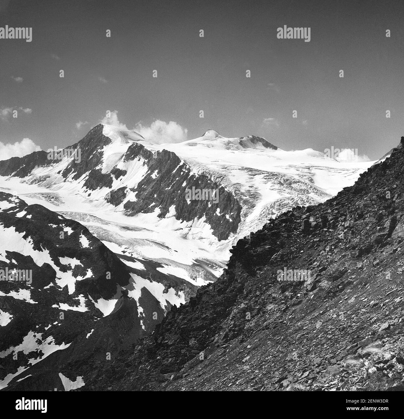 Austria, Tyrol. On the centre skyline is the Zuckerhutl at 3505m the highest mountain in the Stubai Alps with the Wilder Pfaff, the Wild Priest to the left, with the mass of the Sulzenau Ferner glacier in the centre as it was in 1968. Sadly lots of the glacier seen here has now gone due to global warming. Stock Photo