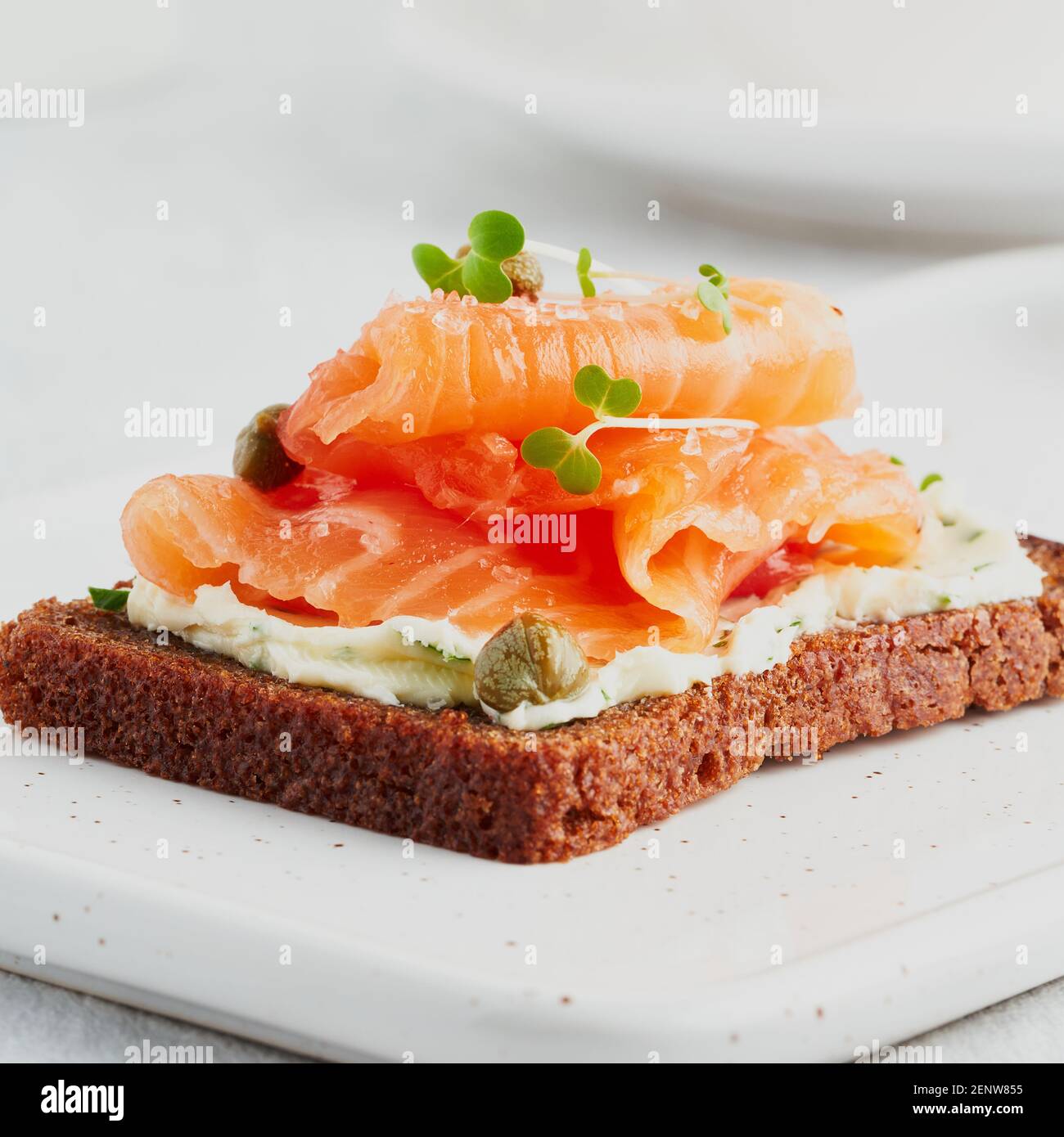 Smorrebrod - traditional Danish sandwiches. Black rye bread with salmon ...