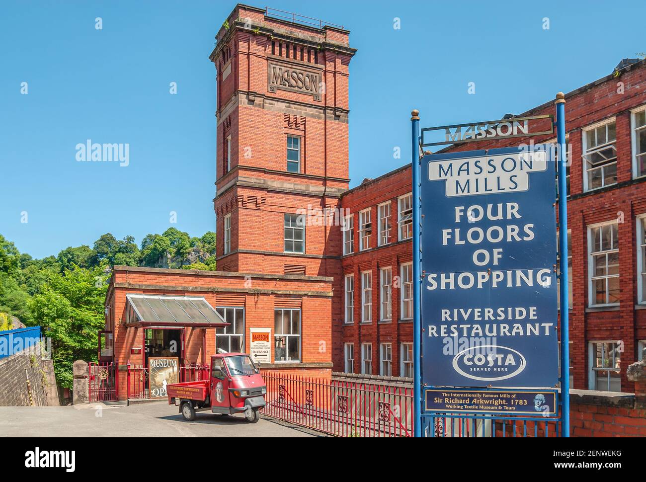 Arkwright's imposing red brick Masson Mill is a water-powered cotton spinning mill  River Derwent in Matlock Bath Stock Photo
