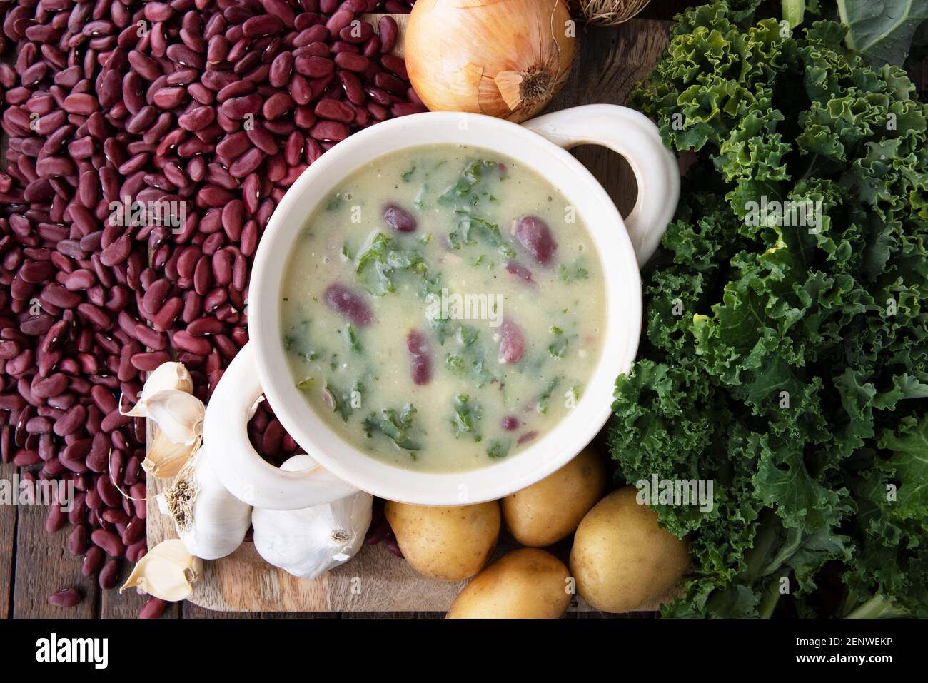 Portuguese Caldo Verde soup flat lay with ingrediients. Stock Photo