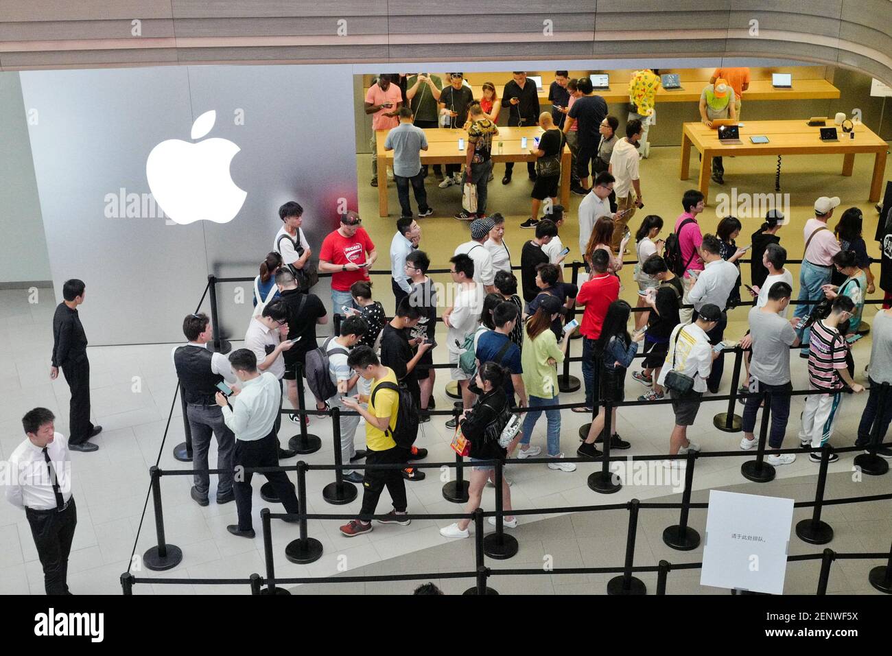 Customers queue up in front of the East Nanjing Road Flagship Apple Store  in Shanghai, China, 20 September 2019. The tech giant Apple Inc released  three new iPhones on Thursday (19 September