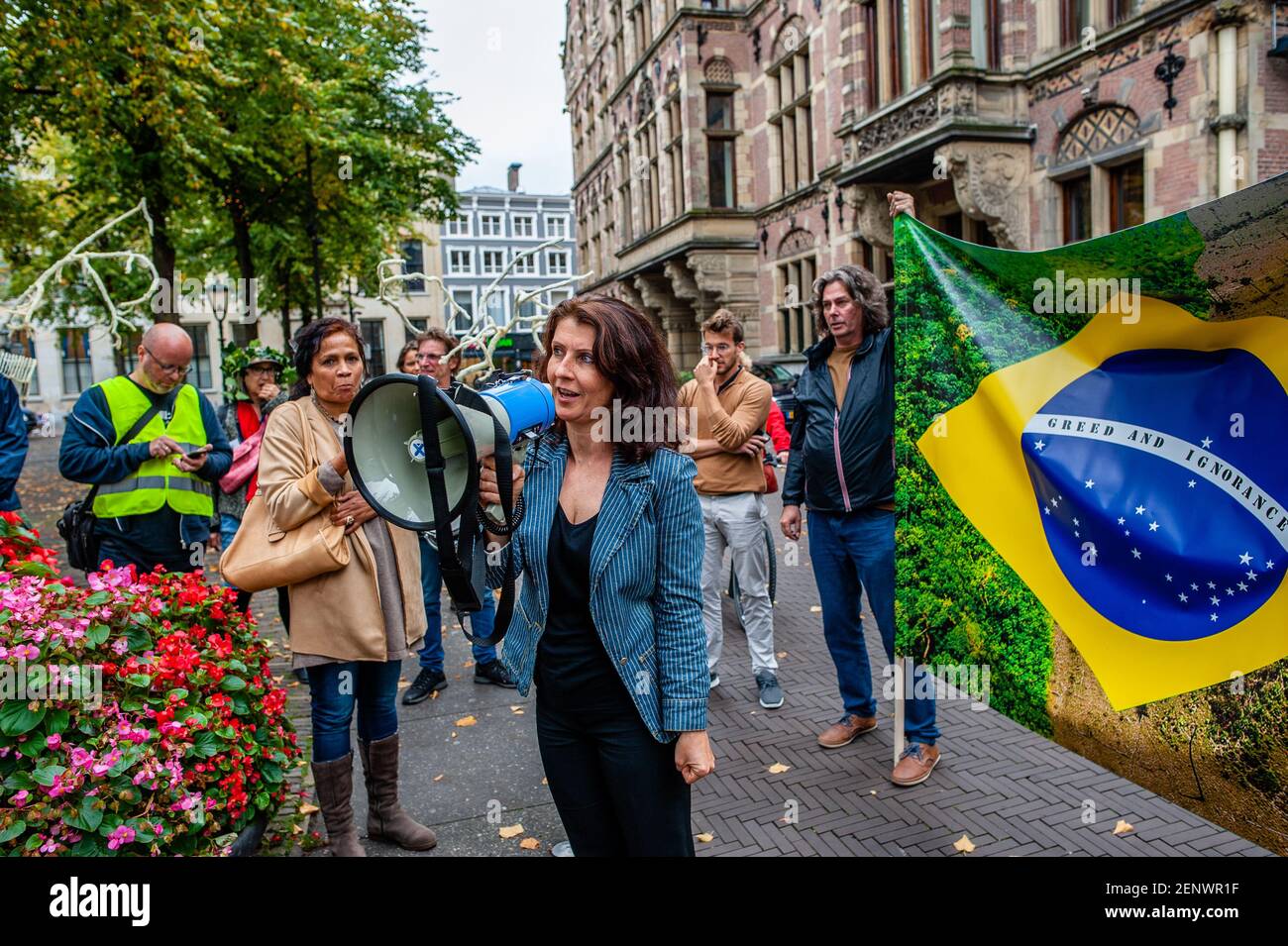 Esther Ouwehand, one of the five Members of Parliament of the Party for the  Animals speaking on a megaphone during the demonstration. After  Arnhem-based artist, Rob Voerman opened a petition to save