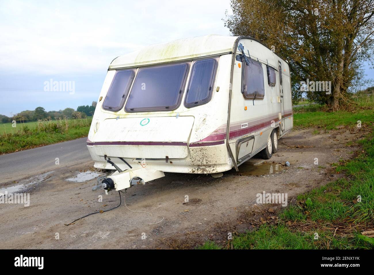 October 2020 - Large touring caravan dumped on the roadside near Glastonbury, Somerset, UK Stock Photo