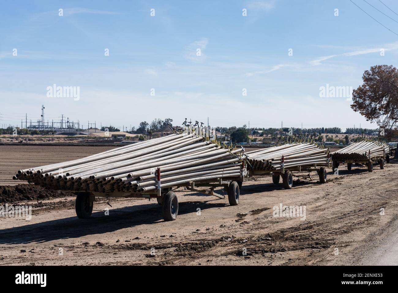 Stacks of irrigation pipe on trailers for use in irrigating the farm